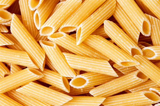 Macaroni pasta making a background pattern