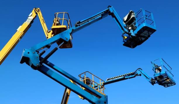 istock Aerial working platforms of cherry picker against blue sky 1097404598