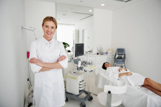istock Beautiful doctor posing with crossed arms while young lady resting 1097405724