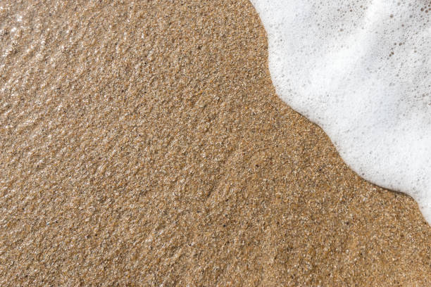 istock Sand background with wave. Beautiful sand background and wave from sea. Sand Texture background. Closeup of sand. 1097405760