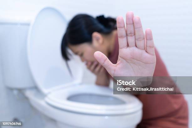 Woman Hold Hand And Vomiting In Toilet Sick Concept Stock Photo - Download Image Now