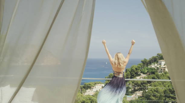 istock Seductive woman hiding behind transparent curtain 1097406158