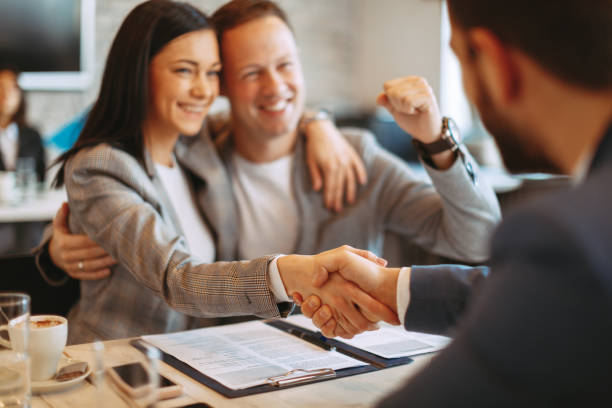 istock Young business couple make a deal and shake hands 1097407350