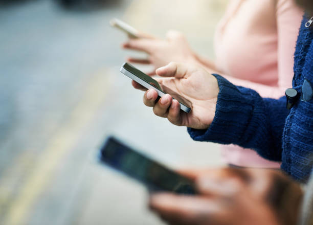 istock Connecting their devices in the city 1097409030
