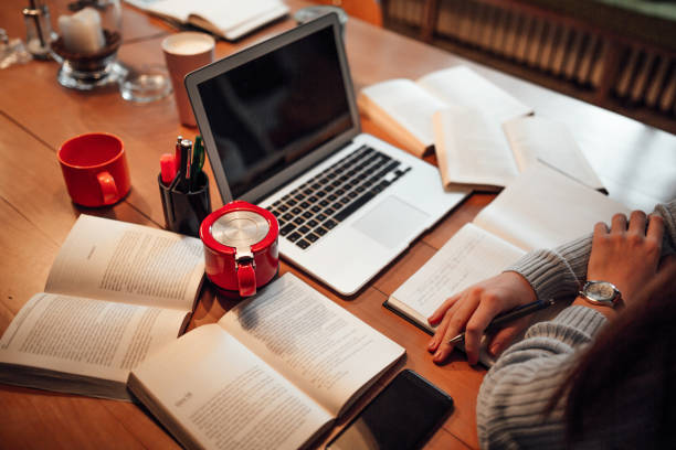 istock Office desk with laptop and books, top view 1097409478