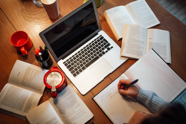 istock Office desk with laptop and books, top view 1097409552