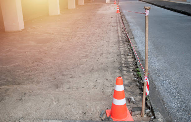 istock red safety cones and tape on blind floor in site construction and security zone. 1097411632