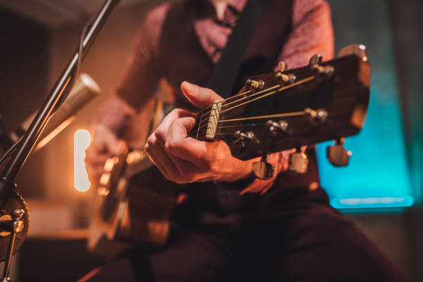 istock Musician playing acoustic guitar 1097411698