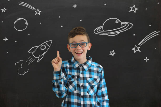 istock Young boy child think idea dreaming imagination space stars 1097411740