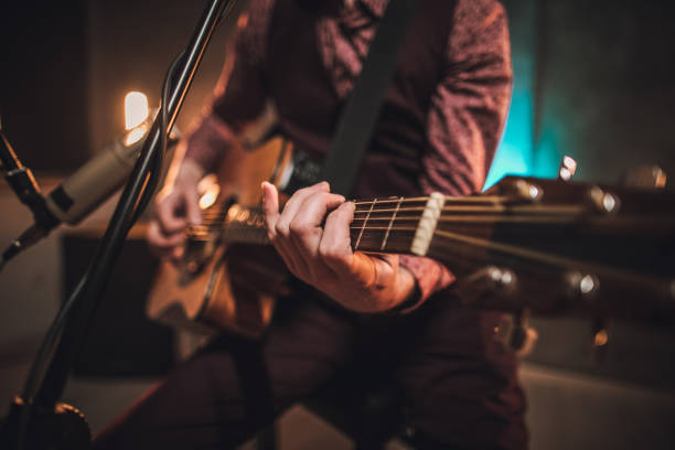 istock Man musician playing acoustic guitar 1097411744