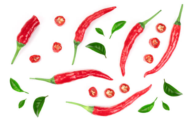 istock sliced red hot chili pepper isolated on white background. Top view. Flat lay pattern 1097414944