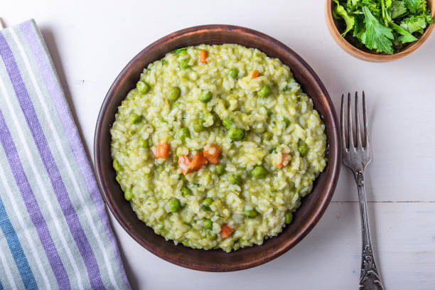 istock Traditional Italian vegetarian risotto with peas in rustic style 1097416962