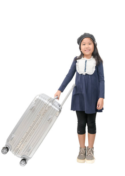 Happy asian girl holding big baggage isolated on white background, travel concept
