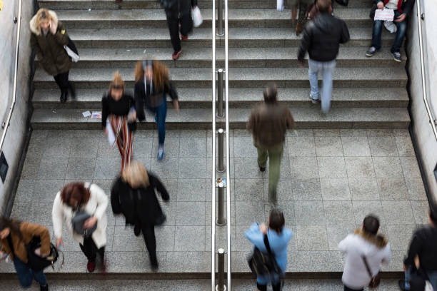 istock People walking up and down the stairs 1097426924
