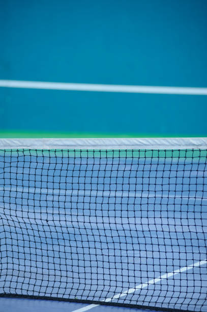 istock tennis court with net background 1097427374