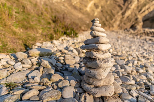 Cairn stacked stones on Warbarrow Beach in Dorset, UK
