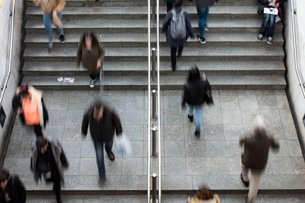 istock People walking up and down the stairs 1097428848