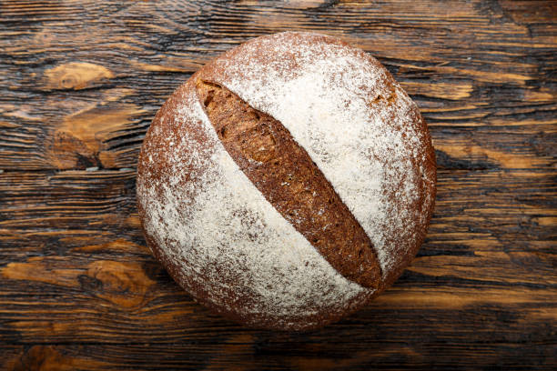 istock black round homemade bread on a rough 1097428914