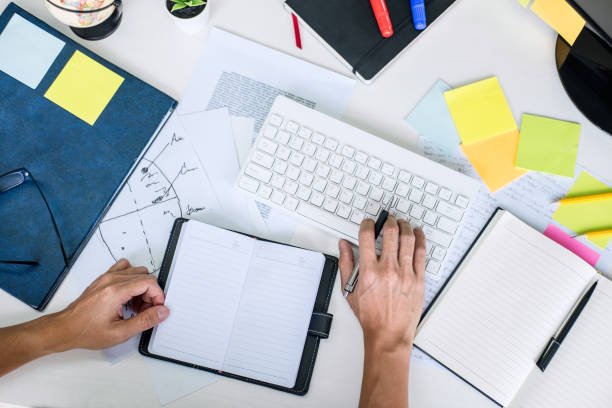 istock Businessman working writing making note business plan and graphic designer with computer in office, top view workspace 1097428992