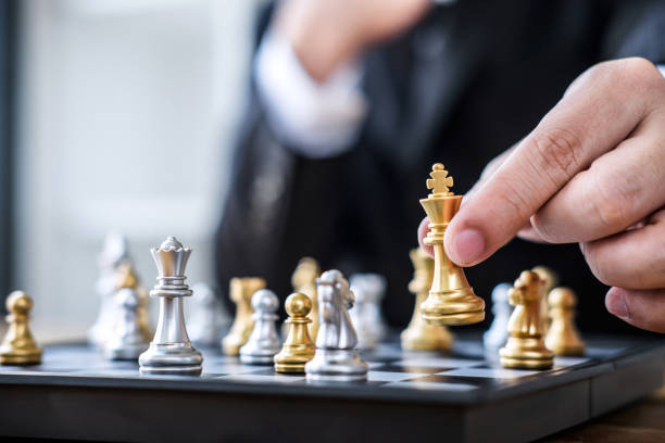 istock Hands of confident businessman playing chess game to development analysis new strategy plan, leader and teamwork concept for win and success 1097431500