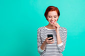 Close up portrait of beautiful cheerful attractive attractive she her lady with telephone in hand writing reading love letter from boyfriend wearing white striped pullover isolated on teal background