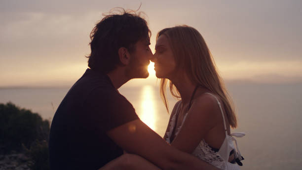 istock Romantic date on a cliff. Waiting for sunset 1097432424