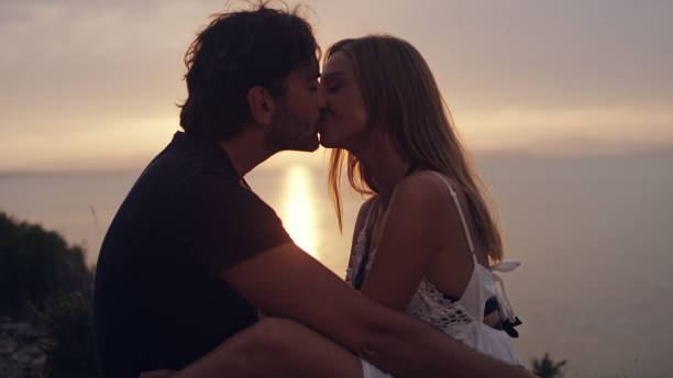 istock Romantic date on a cliff. Waiting for sunset 1097432510