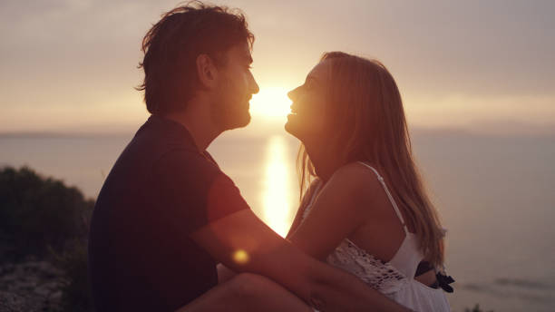 istock Romantic date on a cliff. Waiting for sunset 1097432546