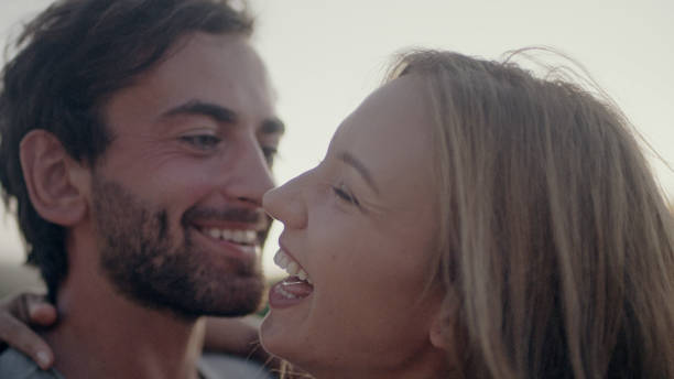 istock Happy couple on vacations. Cuddling in the park 1097432758