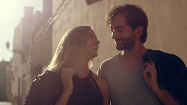 istock Happy couple walking on street 1097432878