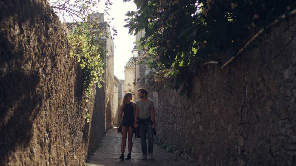 istock Happy couple on vacations. Old town walk 1097432888