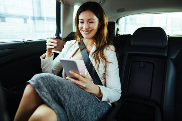 istock Successful businesswoman in a car using mobile phone 1097434604