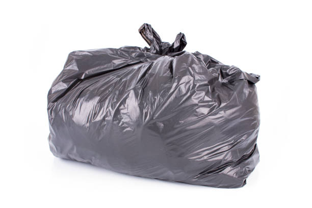 istock Black garbage bag isolated on a white background. 1097435602