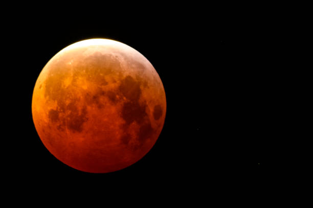 Super blood wolf moon lunar eclipse of January 2019 The super blood wolf moon lunar eclipse of January 2019 in the dark night sky. night sky only stock pictures, royalty-free photos & images