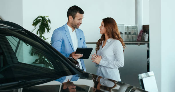 istock Car salesman with a customer 1097436318