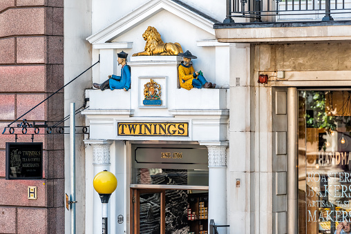 London, UK - June 22, 2018: Closeup of Royal Twinings tea store building sign exterior with nobody center of downtown district city with old architecture