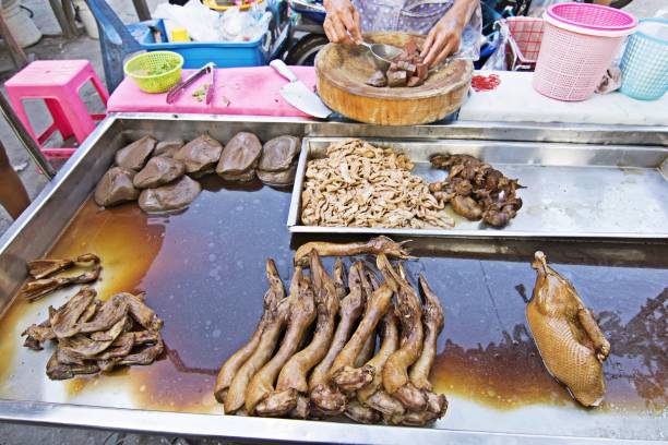 istock Pot-stewed duck on street market stall. 1097438682