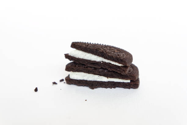 istock Close up section view cookie and cream isolated on white background. 1097439064