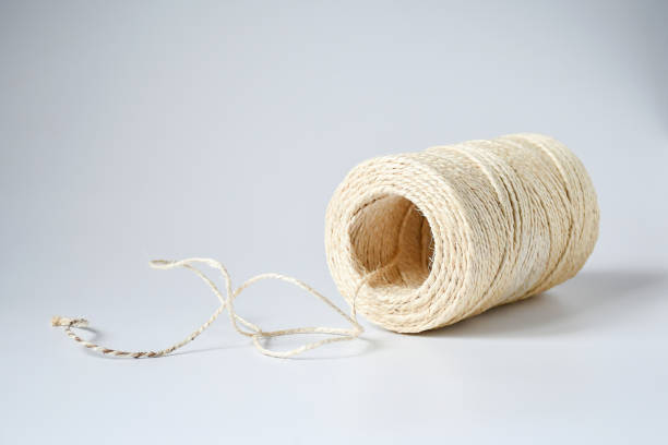 istock Linen roll yellow white string object on white background, Natural Brown Shabby Style Rustic String Twine Shank Craft ,string use for tight things together and creative idea for hobby. 1097447884