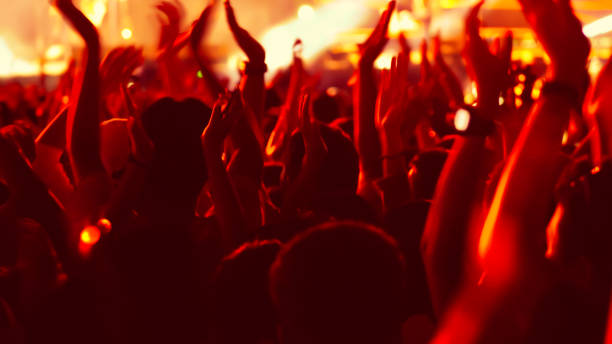 istock abstract colorful background audience in public concert. 1097448816