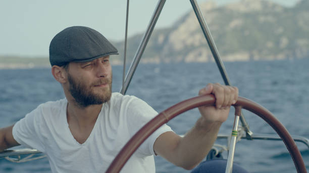 Active man sailing on sea.