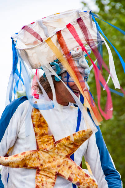 Performer in costume carnival for the parade of Armada. France ROUEN, FRANCE - JULY Circa, 2016. Performers men in costume carnival gathered on a quay of the river Seine for Armada parade, international meeting of very old boats armada stock pictures, royalty-free photos & images