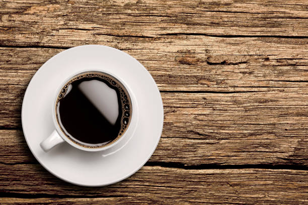 istock Cup of Coffee on wooden background 1097454430