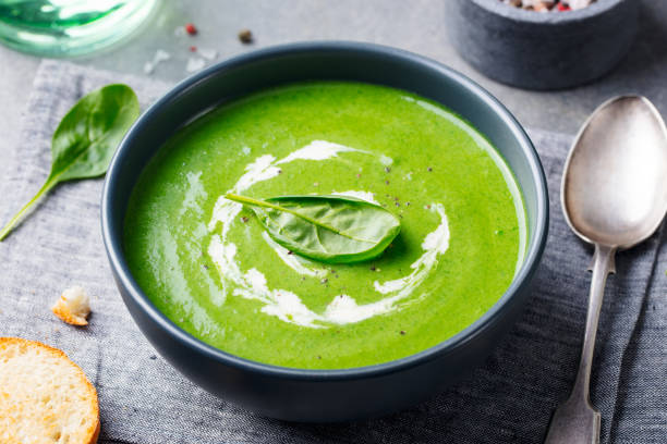 istock Spinach soup with cream in a bowl. Close up. 1097457742