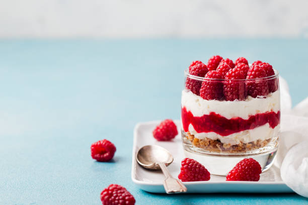 Raspberry dessert, cheesecake, trifle, mouse in a glass. Copy space