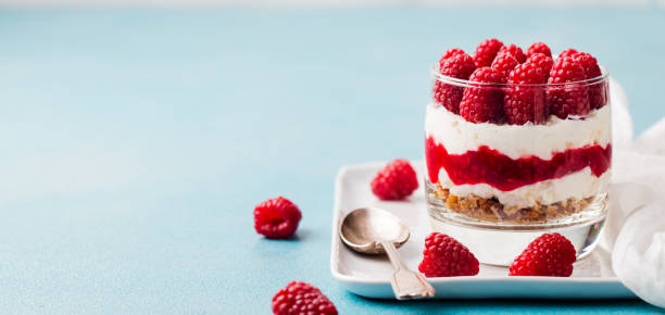 istock Raspberry dessert cheesecake, trifle, mouse in a glass. Copy space. 1097459036