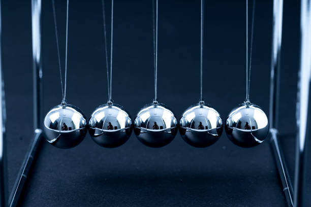 istock Newtons Cradle balancing balls, business concept in studio 1097459204