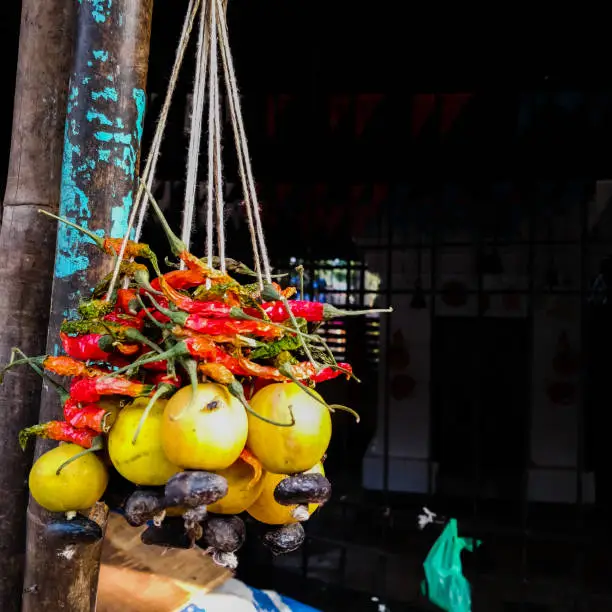 Photo of lemon and chillies tied