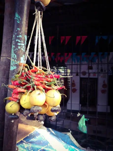 Photo of lemon and chillies tied