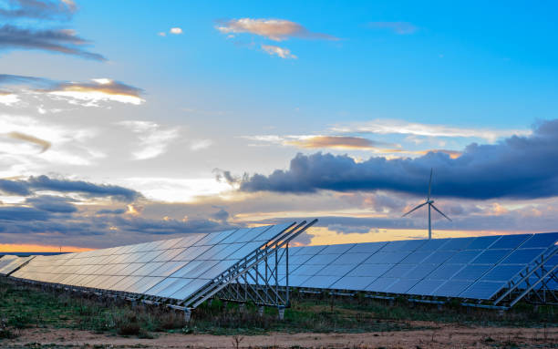 istock Photovoltaic and wind plant at sunset 1097465944